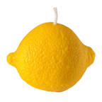 A novelty lemon-shaped candle with a textured yellow rind and a white wick on a solid white background.