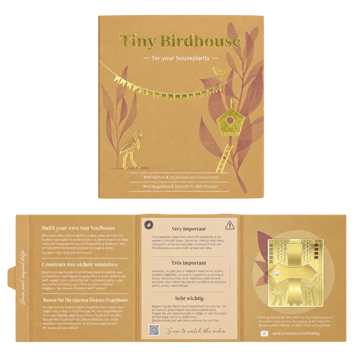 A product presentation of a 'Tiny Birdhouse' kit by Sea Otter Crafts, showing both the outer kraft paper packaging and the fully unfolded instruction booklet. The packaging is a warm tan color with gold foil accents and illustrations of a birdhouse and a deer.