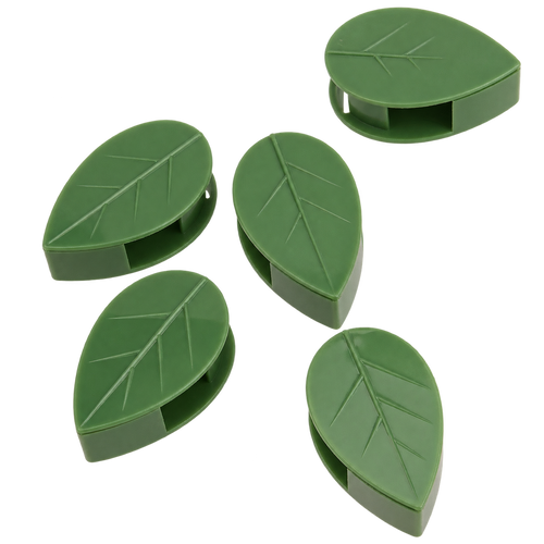 Five green plastic plant clips shaped like leaves, arranged on a plain white background.